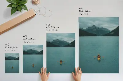Premium wall art featuring a peaceful turquoise lake with a kayaker and mountain scenery