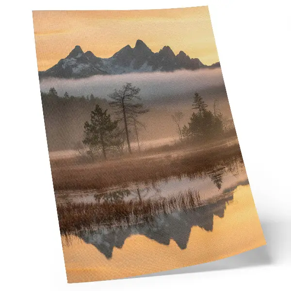 Art print featuring mountains, trees, and fog over calm reflected water