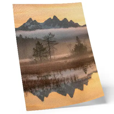 Art print featuring mountains, trees, and fog over calm reflected water