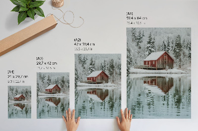 Art print A red cottage among snowy trees by the water
