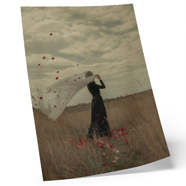 Decorative poster A figure in a field among red petals