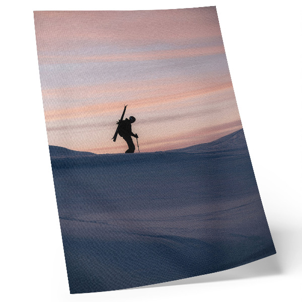 Art print Skier against a pink sky in a winter landscape