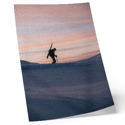 Art print Skier against a pink sky in a winter landscape