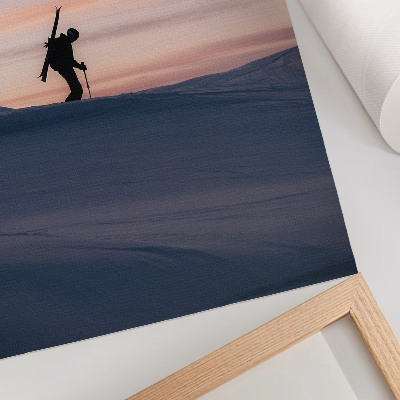 Art print Skier against a pink sky in a winter landscape