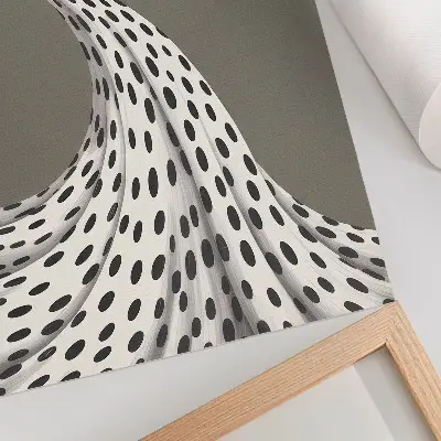 Decorative poster with a minimalist black dots pattern on a beige background