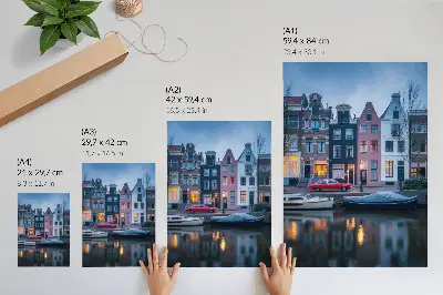 Art print colorful tenement houses in the evening atmosphere reflected in the water