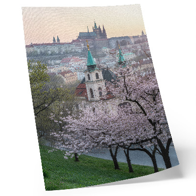 Decorative poster the city in spring with flowering trees and church towers