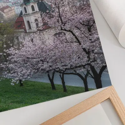 Decorative poster the city in spring with flowering trees and church towers