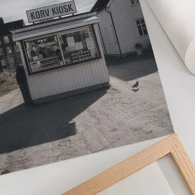 Art print featuring wooden kiosks and bright idyllic buildings