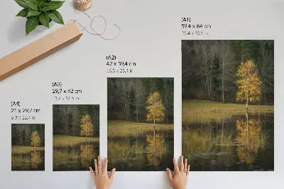 Decorative poster golden tree against a dark forest and lake background