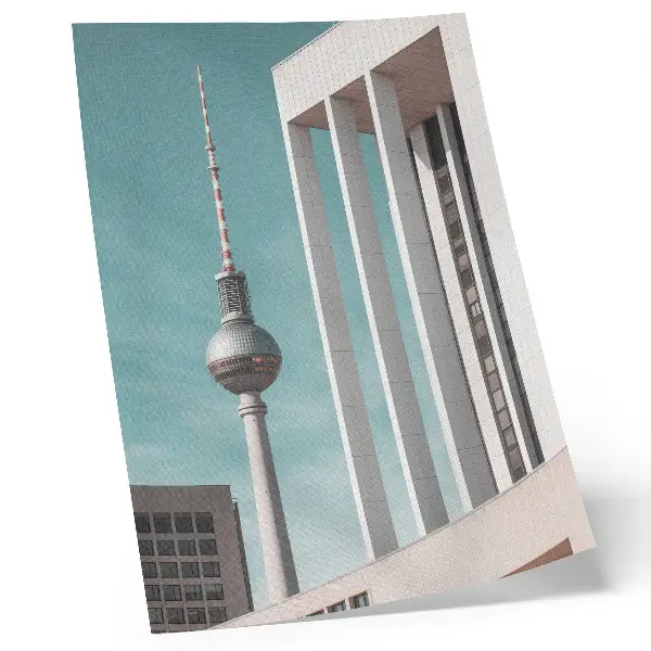 Decorative poster minimalist tower with modern buildings against a blue sky