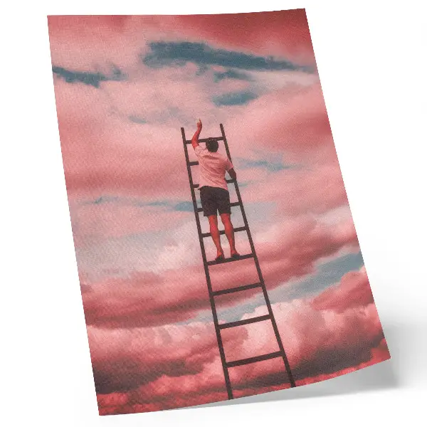 Premium wall art person on a ladder reaching into pink clouds in the sky