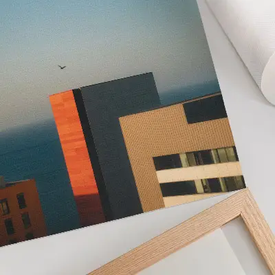 Decorative poster featuring a modern coastal scene with buildings and birds in a vast sky