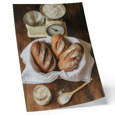 Poster bread basket with flour and a scale on a wooden surface