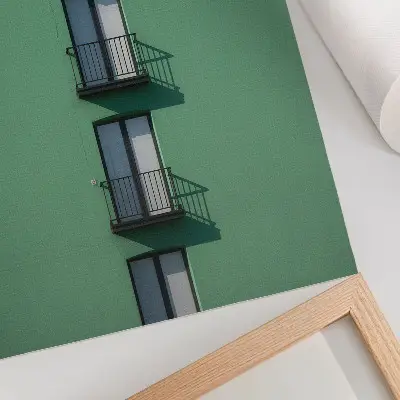 Poster green facade with windows, balconies, and shadows in a modern style