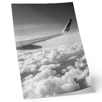 Decorative poster airplane wing above the clouds in black and white style