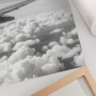 Decorative poster airplane wing above the clouds in black and white style