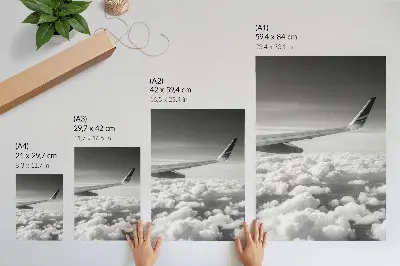 Decorative poster airplane wing above the clouds in black and white style