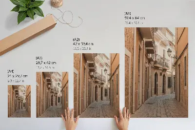 Decorative poster narrow street with stone buildings in warm shades