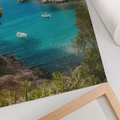Poster a picturesque landscape featuring a bay with boats and a house