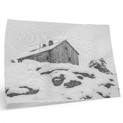 Decorative canvas print A minimalist winter house against the backdrop of snow