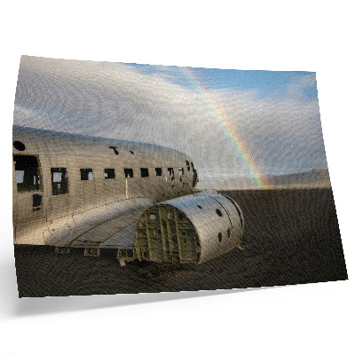 Decorative canvas print A metal plane wreck with a rainbow in the background.