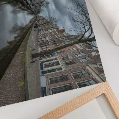 Poster featuring a canal with gentle architecture and an atmospheric sky