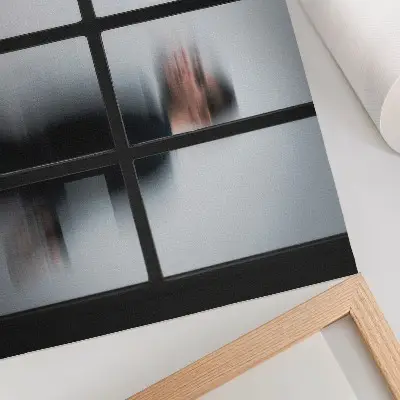 Decorative canvas print black silhouette behind a glass frame in gray minimalist style