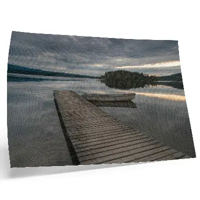 Decorative canvas print featuring a calming lake scene with a boat, forest, and clouds