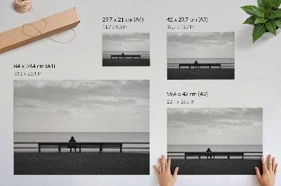 Decorative canvas print Person on a bench by the sea gray harmony