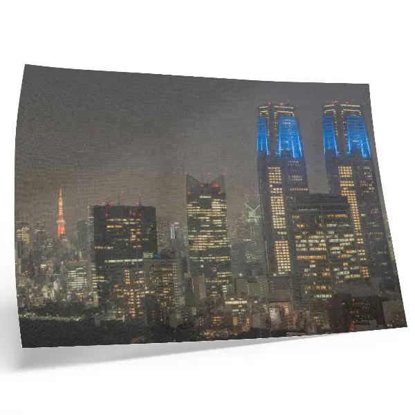 Decorative canvas print featuring skyscrapers and modern buildings illuminated at night