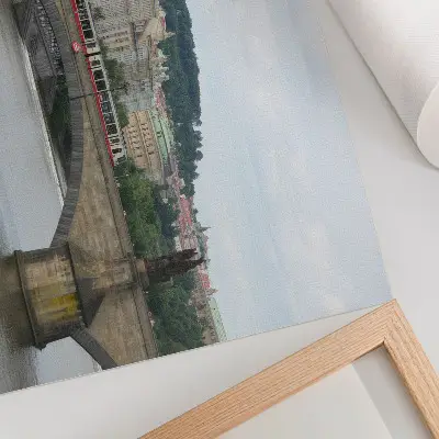 Poster a bridge over the river with a tram and classical architecture