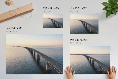 Decorative canvas print A bridge over a calm sea at sunset