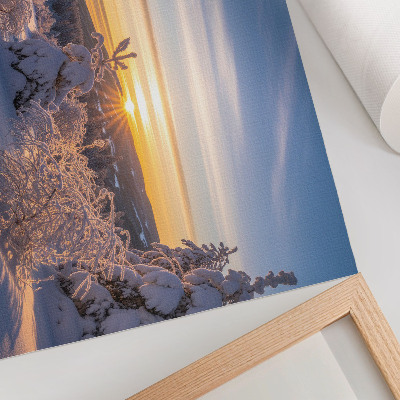 Decorative canvas print Winter landscape with snow and sun on the horizon