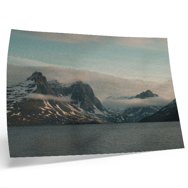 Decorative canvas print Monumental mountains in the shadow of peace and clouds