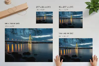 Illuminated bridge over the water at night decorative canvas print
