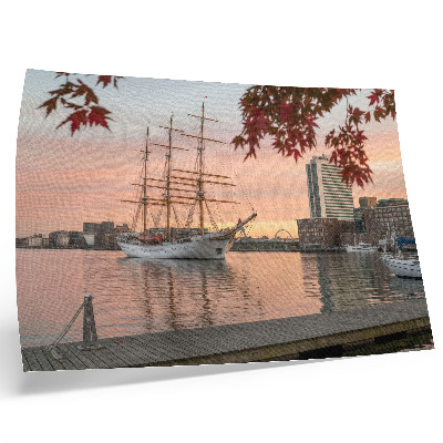 Decorative canvas print A sailing ship at sunset, a peaceful panorama of the city