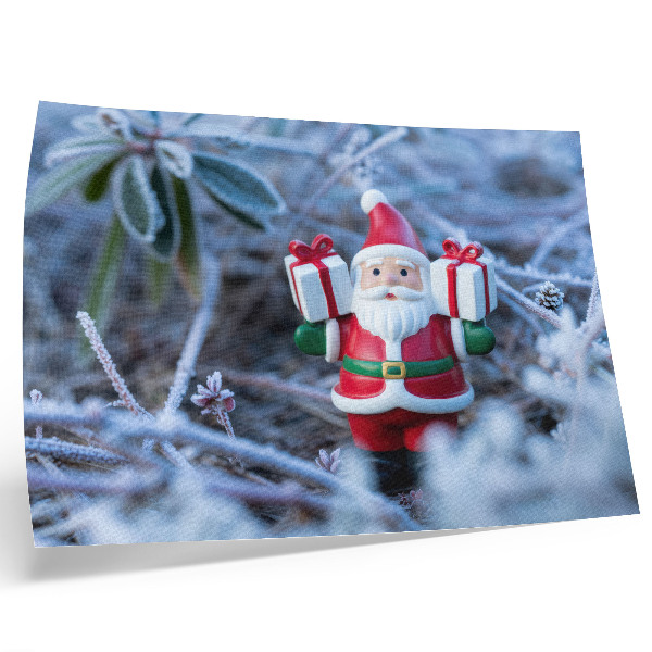 Decorative canvas print Santa Claus with gifts in a winter setting