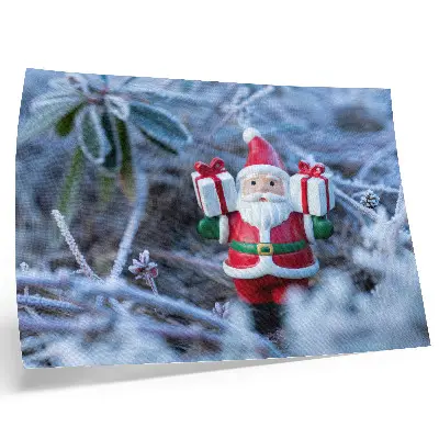 Decorative canvas print featuring Santa Claus with gifts in a winter setting