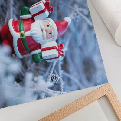 Decorative canvas print featuring Santa Claus with gifts in a winter setting