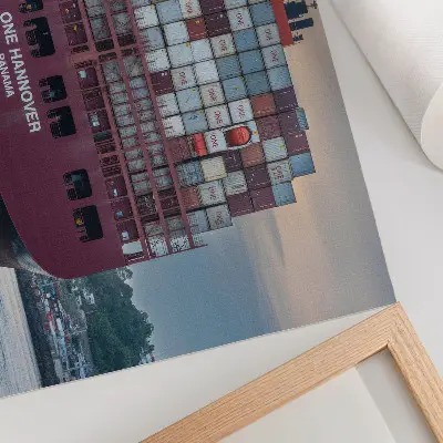 Container ship poster a container ship packed with colorful containers on the water