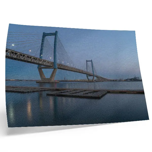 Photo canvas bridge at dusk with calm water and a modern landscape