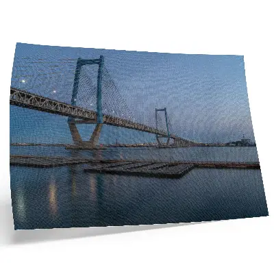 Photo canvas bridge at dusk with calm water and a modern landscape