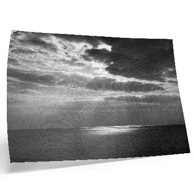 Dynamic sky over a calm ocean poster