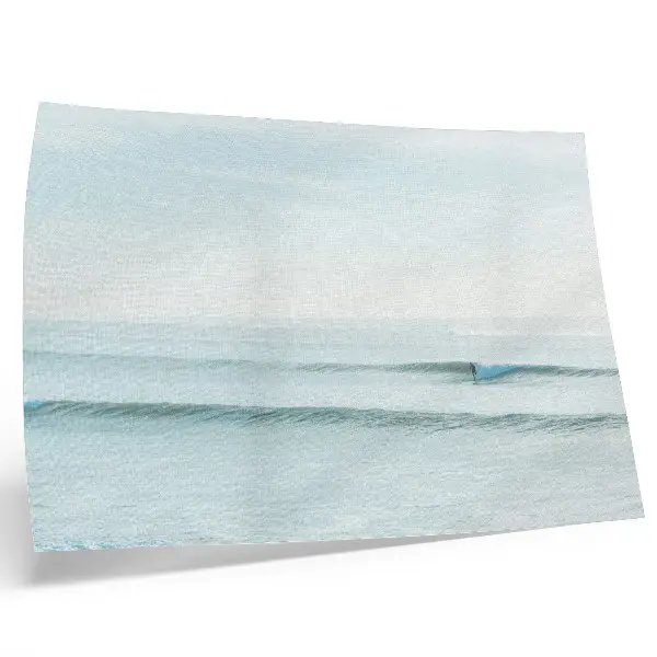 Decorative canvas print featuring a minimalist ocean waves surfer design