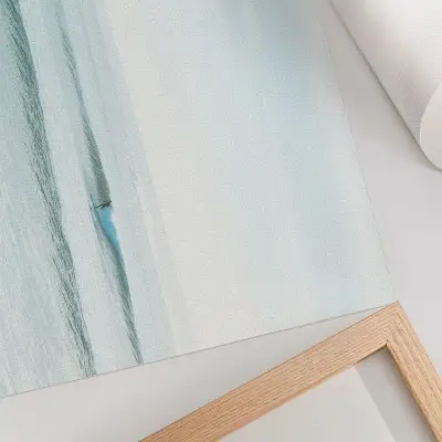 Decorative canvas print featuring a minimalist ocean waves surfer design