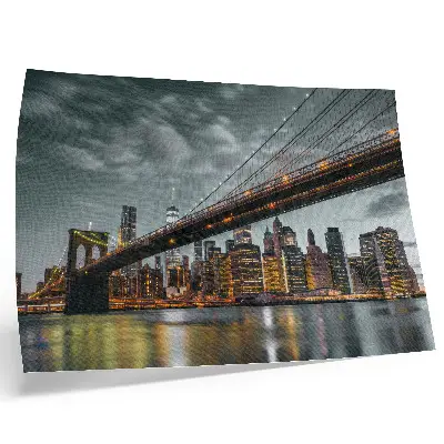 Poster panorama of a city bridge with lights reflected in the water during the evening