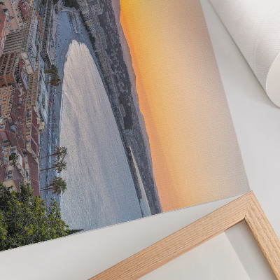 Photo canvas View of the city at sunset over the sea