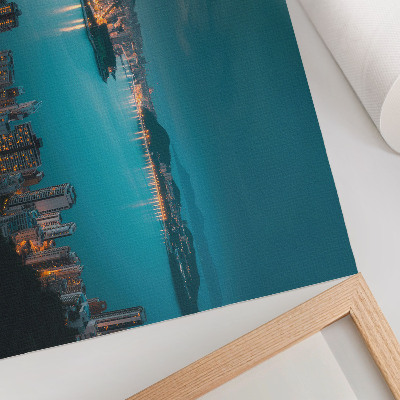Decorative canvas print Night view of the city over the water, luminous skyscrapers