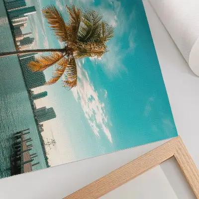 Photo canvas featuring palm trees by a calm lake with skyscrapers under a turquoise sky